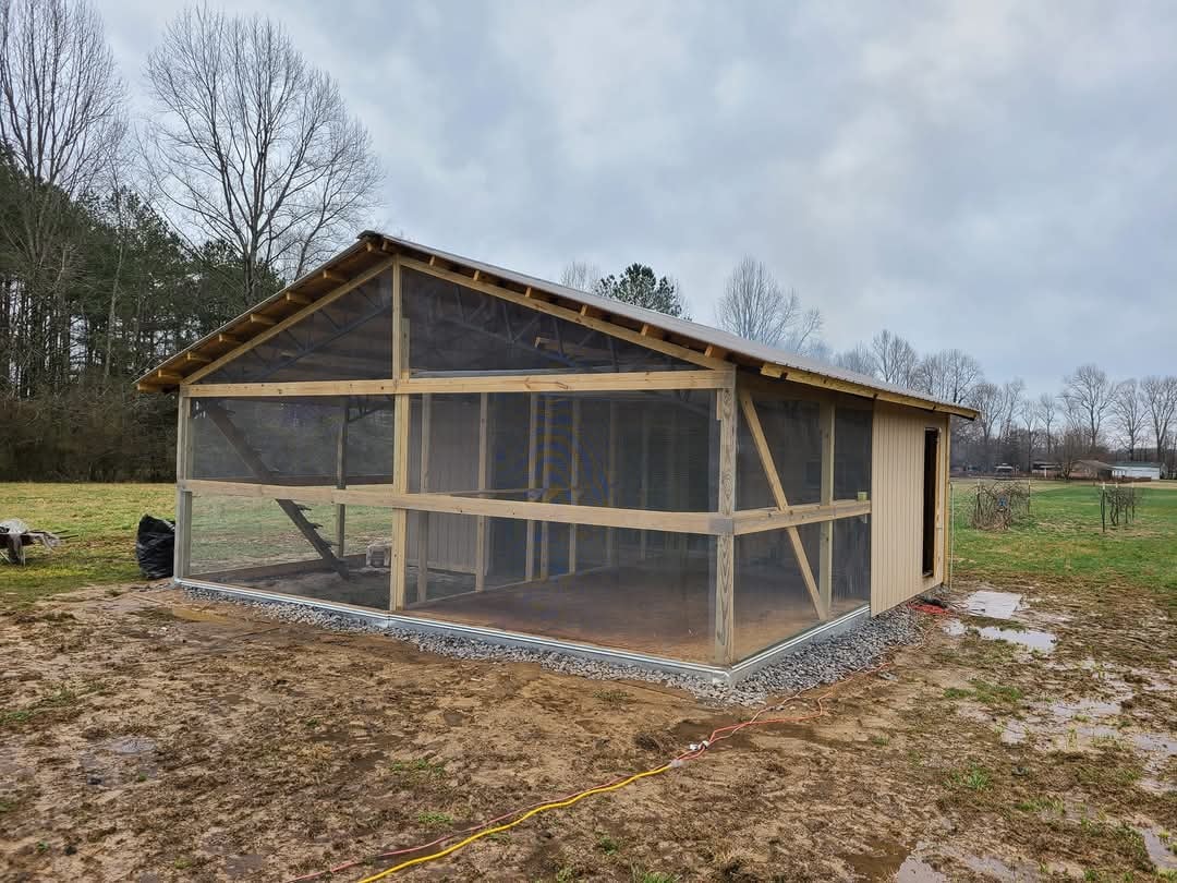 Screened porch structure with wood framing and mesh panels