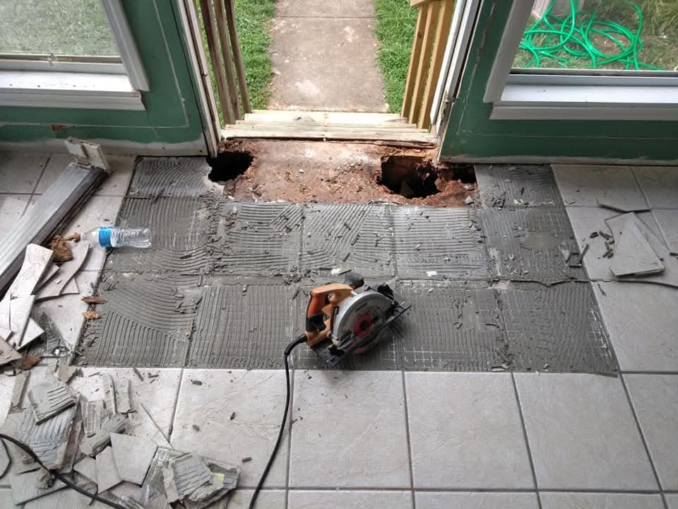 Tile entry repair in progress with old tile removed