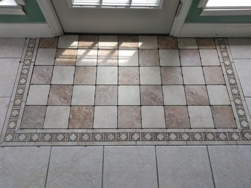 Finished tile entry with a decorative border